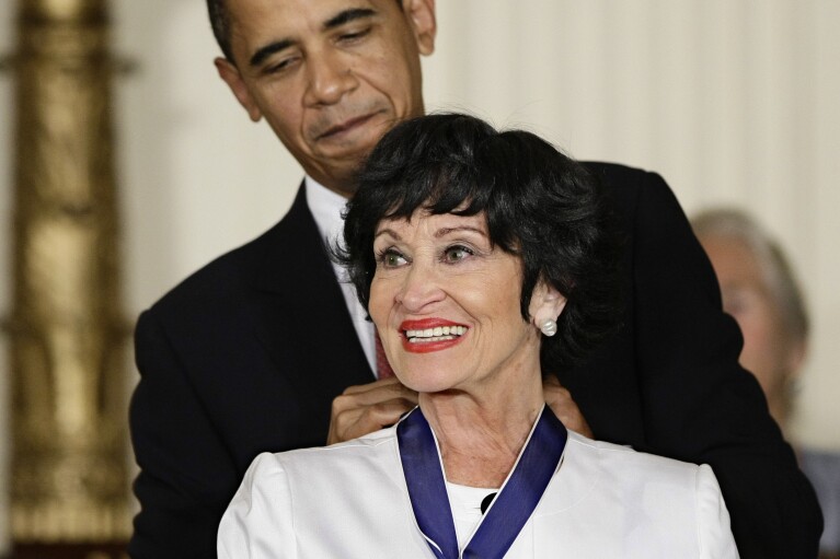FILE - President Barack Obama presents the 2009 Presidential Medal of Freedom to Chita Rivera at the White House in Washington, August 12, 2009.  Rivera, a dynamic dancer, singer and actress who received 10 Tony nominations, winning twice in her long run on Broadway.  A careerist who paved the way for Latina artists died Tuesday.  She was 91 years old.  (AP Photo/J. Scott Applewhite, File)