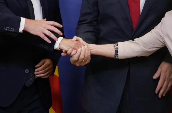 FILE - European Commission President Ursula von der Leyen, right, shakes hands with Albanian Prime Minister Edi Rama, North Macedonia's Prime Minister Dimitar Kovacevski and Czech Republic's Prime Minister Petr Fiala prior to a meeting at EU headquarters in Brussels, Tuesday, July 19, 2022. Leaders from more than 40 countries will gather Thursday, Oct. 6, 2022, in Prague, to launch a "European Political Community" aimed at boosting security and economic prosperity across the continent, but critics claim the new forum is an attempt to put the brakes on European Union enlargement. (AP Photo/Virginia Mayo, File)