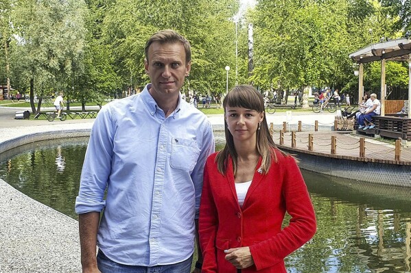 In this photo provided by Alexei Navalny's team, Ksenia Fadeyeva, right, poses for a photo with Alexei Navalny in Tomsk, Russia on Aug. 2020. An associate of imprisoned Russian opposition leader Alexei Navalny was sentenced on Friday Dec. 29, 2023 to nine years in prison, the latest move in a relentless Kremlin crackdown on dissent. Fadeyeva, a former regional legislator who headed a local branch of Navalny's organization in the Siberian city of Tomsk, was convicted on charges of organizing an extremist group. (Alexei Navalny's team via AP)