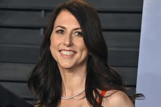 FILE - In this March 4, 2018, file photo, then-MacKenzie Bezos arrives at the Vanity Fair Oscar Party in Beverly Hills, Calif. Galvanized by the racial justice protests and the coronavirus pandemic, charitable giving in the United States reached a record $471 billion in 2020, according to a Giving USA report released Tuesday, June 15, 2021. MacKenzie Scott stormed the philanthropy world in 2020 with $5.7 billion in unrestricted donations to hundreds of charities. The seven- and eight-figure gifts were the largest many had ever received. (Photo by Evan Agostini/Invision/AP, File)