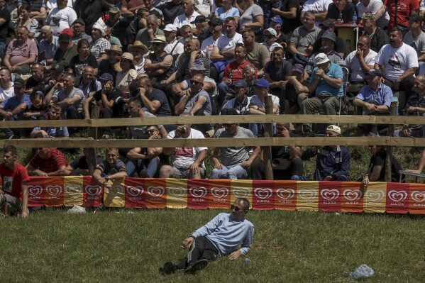 People watch the bullfights in Bijelo Polje, Bosnia, Sunday, May 11, 2025. (AP Photo/Armin Durgut)