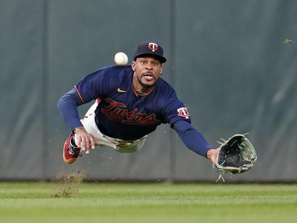 Minnesota Twins center fielder Byron Buxton fails to catch a single by Texas Rangers' Ezequiel Duran during the sixth inning of a baseball game Monday, Aug. 22, 2022, in Minneapolis. (AP Photo/Abbie Parr)