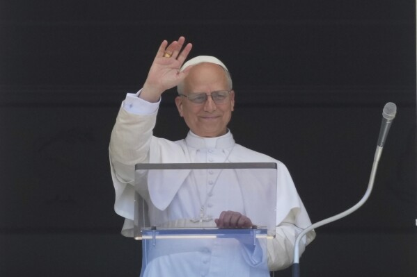 Pope Leo XIV blesses faithful and pilgrims gathered in St. Peter's Square for the Regina Caeli noon prayer, Sunday, May 25, 2025. (AP Photo/Andrew Medichini)