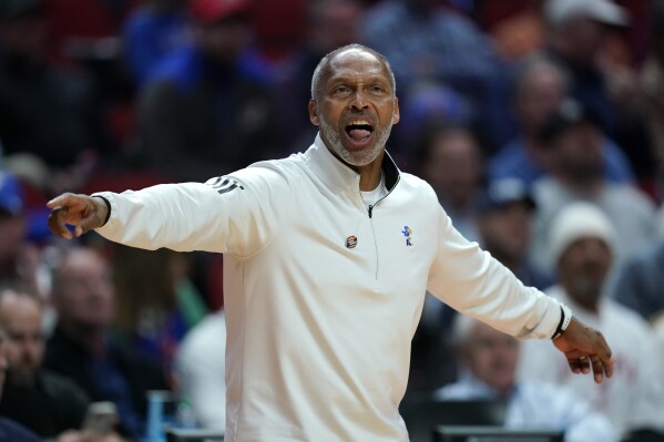 Kansas acting head coach Norm Roberts directs his team in the first half of a second-round college basketball game against Arkansas in the NCAA Tournament, March 18, 2023, in Des Moines, Iowa. (AP Photo/Charlie Neibergall, file)