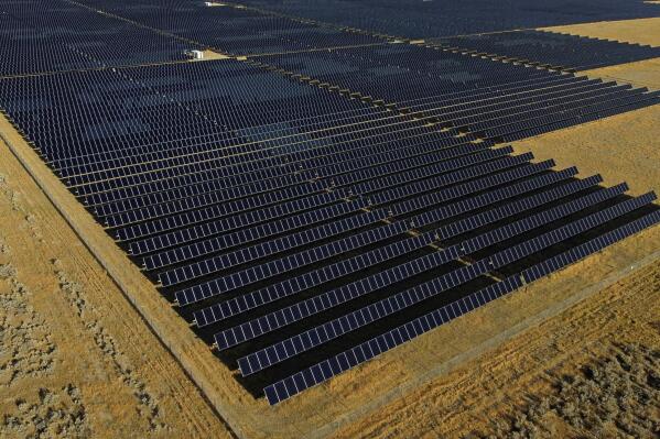 FILE - A solar farm sits in Mona, Utah, on Tuesday, Aug. 9, 2022. The House voted Friday, April 28, 2023, to reinstate tariffs on solar panel imports from several Southeast Asian countries after President Joe Biden paused them in a bid to boost the U.S. solar industry, a key part of his climate agenda.(AP Photo/Rick Bowmer, File)