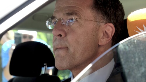 Dutch Prime Minister Mark Rutte sits in a car as he leaves the Huis ten Bosch palace in The Hague, The Netherlands, Saturday, July 8, 2023 after informing King Willem-Alexander that his coalition government has resigned .  Rutte announced the collapse of the government on Friday night and refused to take questions from reporters as he left.  (AP Photo/Michael Corder)