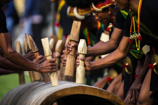 Indigenous Nagas perform a warrior dance dance during the Hornbill Festival in Kisama, on the outskirts of Kohima, capital of the northeastern Indian state of Nagaland, Tuesday, Dec. 10, 2024. (AP Photo/Anupam Nath)