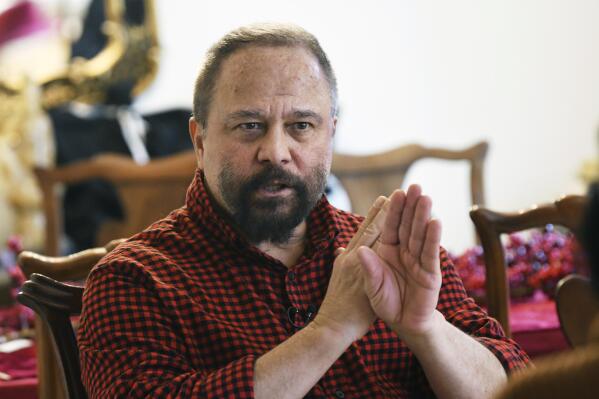Michigan State University professor Marco Díaz-Muñoz talks during an interview at his home in Lansing, Mich., Thursday, Feb. 16, 2023. Díaz-Muñoz is still haunted by what he witnessed last Monday night, when a gunman entered his classroom in Berkey Hall, killing two of his students in what he describes as “12 minutes of terror.” (Clarence Tabb Jr./Detroit News via AP)