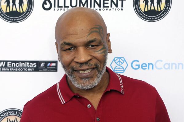 FILE - In this Aug. 2, 2019 photo, Mike Tyson attends a celebrity golf tournament in Dana Point, Calif. Authorities are investigating after cellphone video appears to show Mike Tyson hitting another passenger on a plane at San Francisco International Airport. (Photo by Willy Sanjuan/Invision/AP, File)