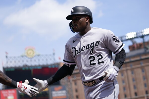Chicago White Sox's Oscar Colas runs to the dugout hitting a two-run home run off Baltimore Orioles starting pitcher Kyle Gibson during the second inning of a baseball game, Wednesday, Aug. 30, 2023, in Baltimore. White Sox's Elvis Andrus scored on the home run. (AP Photo/Julio Cortez)