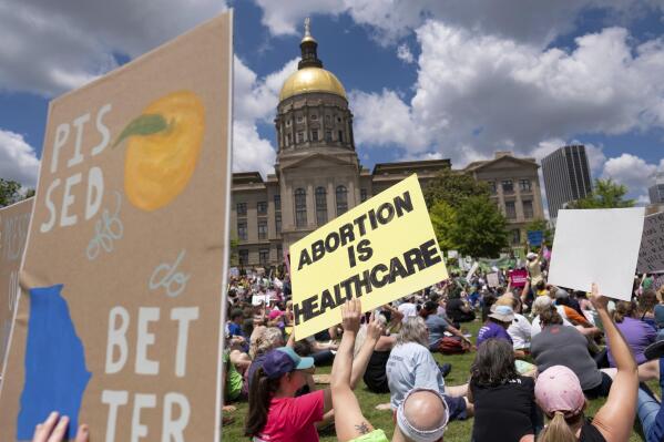 FILE - Abortion rights protesters rally near the Georgia State Capitol in Atlanta on May 14, 2022. A federal appeals court on Wednesday, July 20, 2022, overturned a lower court ruling and said Georgia’s restrictive 2019 abortion law should be allowed to take effect. The Georgia law bans most abortions once a “detectable human heartbeat” is present. (Ben Gray /Atlanta Journal-Constitution via AP, File)