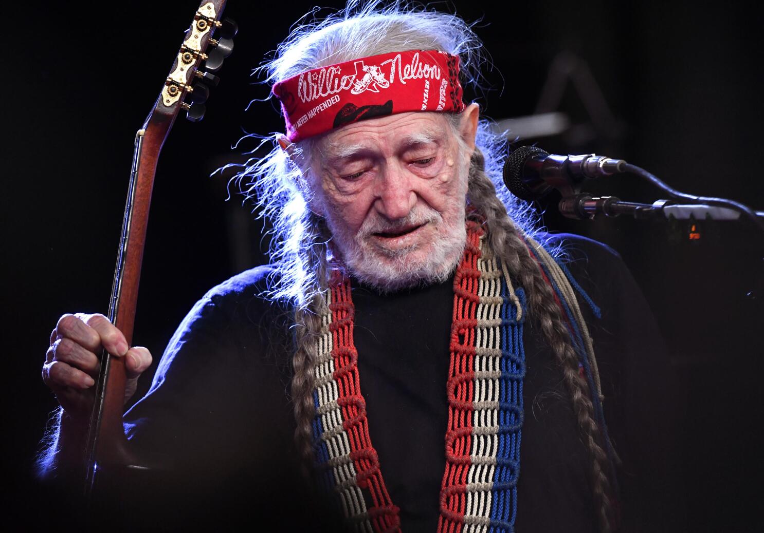 Willie Nelson inhales the love at 90th birthday concert | AP News