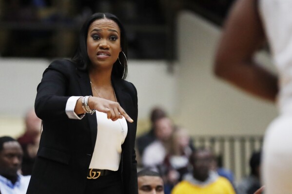 FILE - Jackson State coach Tomekia Reed calls out to her team during the first half of an NCAA college basketball game against Mississippi State, Thursday, Nov. 21, 2019, in Jackson, Miss. Charlotte announced the hiring of Tomekia Reed as women’s basketball coach on Thursday, April 25, 2024, after she helped Jackson State win five consecutive Southwestern Athletic Conference championships during a highly successful six-year tenure with the Tigers. (AP Photo/Rogelio V. Solis, File)