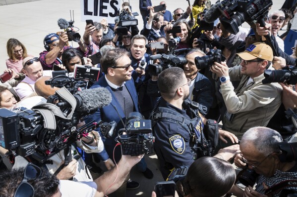 CORRECTS PARTY AFFILIATION - FILE - Rep. George Santos, R-N.Y., speaks to reporters as he leaves the federal courthouse in Central Islip, N.Y., Wednesday, May 10, 2023. The House Ethics panel says it has found “substantial evidence” of lawbreaking by Republican Rep. George Santos of New York and has referred its findings to the Justice Department. The committee said Thursday that Santos’ conduct warrants public condemnation, is beneath the dignity of the office, and has brought severe discredit upon the House. AP Photo/Seth Wenig, File)