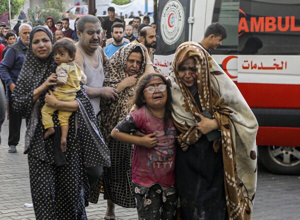 Wounded Palestinians arrive to al-Shifa hospital, following Israeli airstrikes on Gaza City, central Gaza Strip, Monday, Oct. 16, 2023. (AP Photo/Abed Khaled)