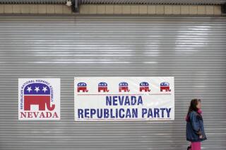 FILE - Campaign signs are posted at Rancho High School where Republican and Democrat caucuses are held, Jan. 19, 2008, in Las Vegas. The Nevada Republican Party is suing the state in an effort to maintain its party-run caucus, even as Nevada shifts to a presidential primary system beginning in 2024. The lawsuit was filed Wednesday, May 31, 2023. (AP Photo/ Ronda Churchill, File)