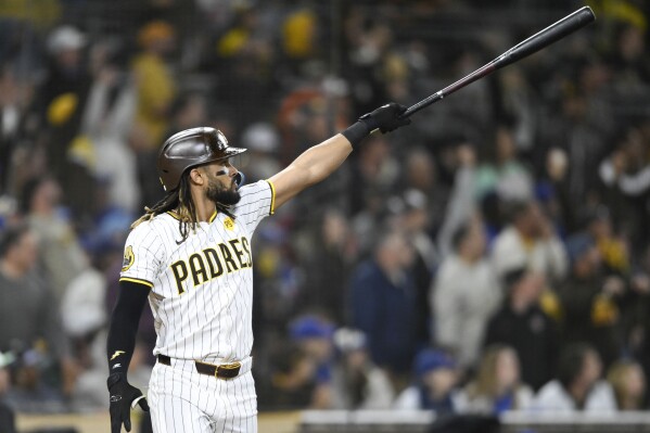 San Diego Padres' Fernando Tatis Jr. watches the flight of his two-run home run during the eighth inning of a baseball game against the Chicago Cubs, Monday, April 8, 2024, in San Diego. (AP Photo/Denis Poroy)