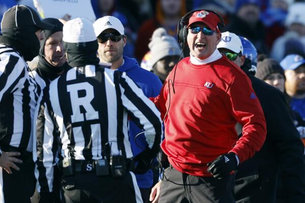 Kansas head coach Lance Leipold, right, reacts to a roughing the passer penalty called on Texas during the second quarter of an NCAA college football game, Saturday, Nov. 19, 2022, in Lawrence, Kan. (AP Photo/Colin E. Braley)