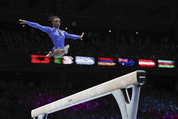 United States' Simone Biles competes on the beam during the women's all-round final at the Artistic Gymnastics World Championships in Antwerp, Belgium, Friday, Oct. 6, 2023. (AP Photo/Geert vanden Wijngaert)