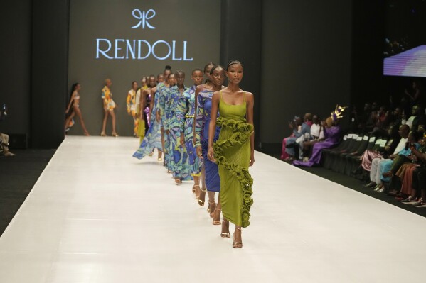 Models wear a creation by Rendoll during the Lagos Fashion Week in Lagos, Nigeria, Thursday, Oct. 26, 2023. Africa's fashion industry is rapidly growing to meet local and international demands but a lack of adequate investment still limits its full potential, UNESCO said Thursday in its new report released at this year's Lagos Fashion Week show. (AP Photo/Sunday Alamba)