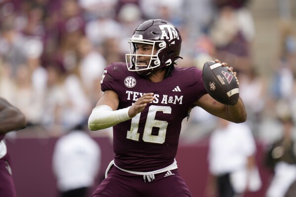 Texas A&M quarterback Jaylen Henderson (16) passes down field against Abilene Christian during the third quarter of an NCAA college football game Saturday, Nov. 18, 2023, in College Station, Texas. (AP Photo/Sam Craft)