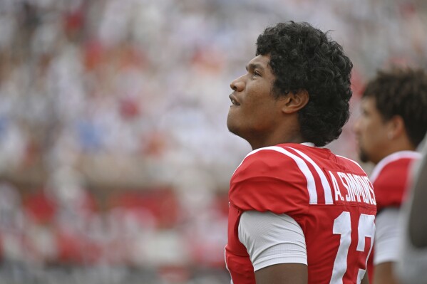 Mississippi quarterback Austin Simmons (13) watches during the first half of an NCAA college football game against Mercer in Oxford, Miss., Saturday, Sept. 2, 2023. (AP Photo/Thomas Graning)