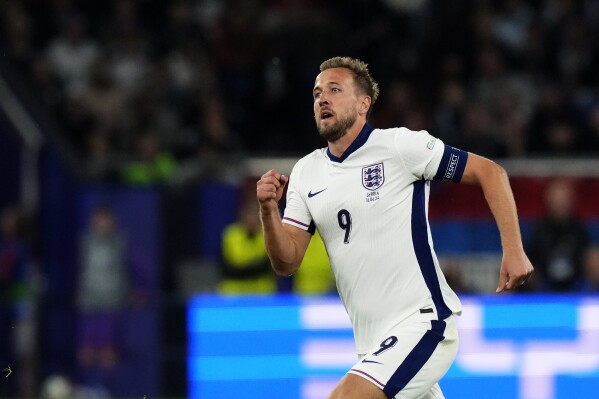 England's Harry Kane runs for the ball during a Group C match between Serbia and England at the Euro 2024 soccer tournament in Gelsenkirchen, Germany, Sunday, June 16, 2024. (AP Photo/Frank Augstein)