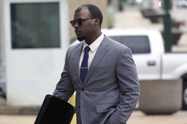 Justin Smith, one of three former Memphis police officers charged in the 2023 fatal beating of Tyre Nichol, arrives at the federal courthouse for the day's proceedings on Tuesday, Oct. 1, 2024, in Memphis, Tenn. (AP Photo/Karen Pulfer Focht)