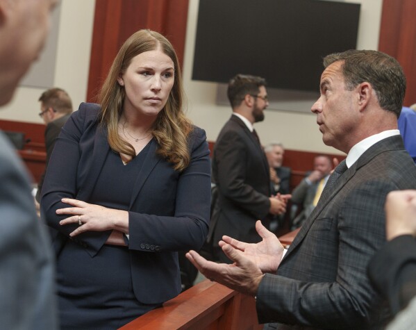 Attorney Taylor Meehan talks with Utah House Speaker Brad Wilson during a break in oral arguments for a case challenging the state's congressional districts before the Utah Supreme Court in Salt Lake City, Tuesday, July 11, 2023. (Leah Hogsten/The Salt Lake Tribune via AP, Pool)
