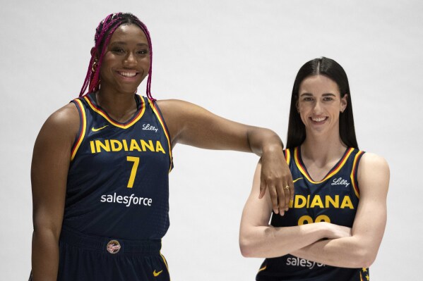 Indiana Fever's Aliyah Boston, left, and Caitlin Clark pose for a photo during the Indiana Fever media day, Wednesday, May 1, 2024, in Indianapolis. (AP Photo/Darron Cummings)
