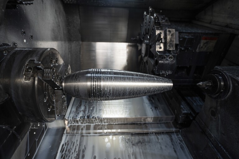 A mortar shell on a lathe at a factory in Ukraine, on Wednesday, January 31, 2024. (AP Photo/Evgeniy Maloletka)