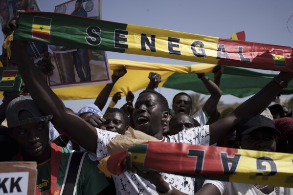 FILE - People shout slogans during a protest against the possibility of President Macky Sall to run for a third term in the presidential elections next year in Dakar, Senegal, Friday, May 12, 2023. West Africa's regional bloc has urged authorities in Senegal to restore the nation’s electoral calendar after its presidential election was delayed. The bloc made the call on Monday just as the United Nations human rights office expressed concerns about the unprecedented decision in one of Africa’s most stable democracies. (AP Photo/Leo Correa, File)