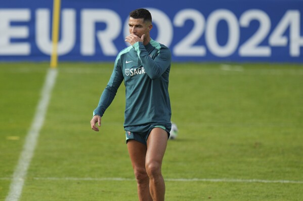 Portugal's Cristiano Ronaldo gestures during a training session in Gutersloh, Germany, Friday, June 14, 2024. Portugal will play against Czech Republic during their Group F soccer match at the Euro 2024 soccer tournament on June 18. (AP Photo/Hassan Ammar)