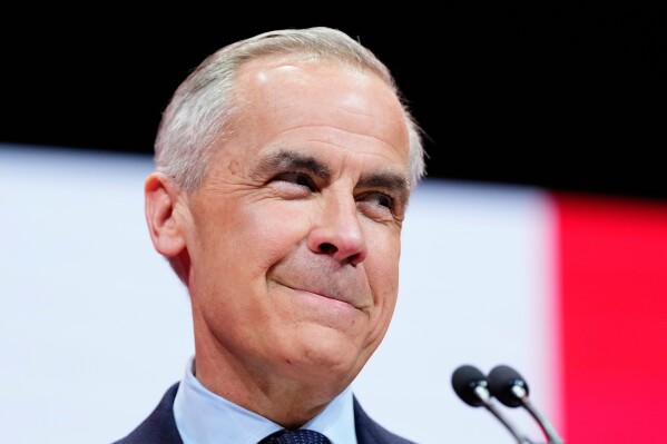 Canadian Prime Minister Mark Carney speaks to supporters on stage at his campaign headquarters after the Liberal Party won the Canadian election in Ottawa, Ontario, Tuesday, April 29, 2025. (Justin Tang/The Canadian Press via AP)