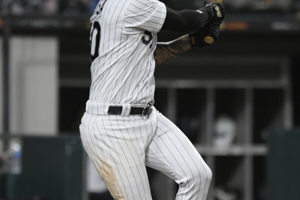 Chicago White Sox's Lenyn Sosa watches his solo home run during the eighth inning of a baseball game against the San Diego Padres, Saturday, Sept. 30, 2023, in Chicago. (AP Photo/Paul Beaty)