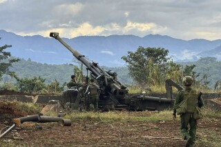 FILE - In this photo provided by the Kokang online media, members of an ethnic armed forces group, one of the three militias known as the Three Brotherhood Alliance, check weapons the group allegedly seized from Myanmar's army outpost on a hill in Hsenwi township in Shan state, Myanmar, on Nov. 24, 2023. Myanmar’s military government confirmed Monday Dec. 11, 2023 that it has been holding talks, brokered by China, with representatives of an alliance of ethnic minority armed groups against which it is engaged in fierce combat in the country’s northeast. (The Kokang online media via AP, File)