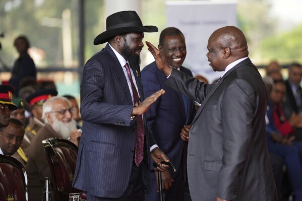 South Sudanese president Salva Kiir Mayardit, left, shakes hands with Pagan Amum Okiech, leader of the Real-SPLM group, during the launch of high-level peace talks for South Sudan at State House in Nairobi, Kenya, on Thursday, May 9, 2024. (AP Photo/Brian Inganga)