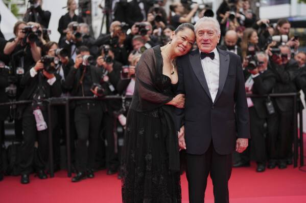Tiffany Chen, left, and Robert De Niro pose for photographers during the opening ceremony red carpet of the 78th international film festival, Cannes, southern France, Tuesday, May 13, 2025. (Photo by Scott A Garfitt/Invision/AP)