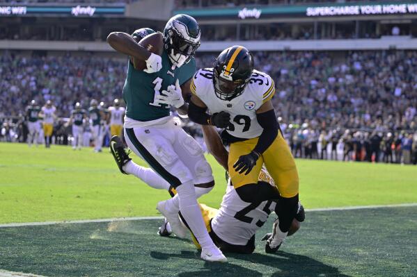 Philadelphia Eagles wide receiver A.J. Brown (11) catches a touchdown pass against Pittsburgh Steelers safety Minkah Fitzpatrick (39) and cornerback Ahkello Witherspoon (25) during the first half of an NFL football game between the Pittsburgh Steelers and Philadelphia Eagles, Sunday, Oct. 30, 2022, in Philadelphia. (AP Photo/Derik Hamilton)