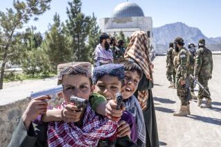 Afghan children enjoy their time on Nadir Khan hill during the first day of Eid al-Fitr in Kabul, Afghanistan, Friday, April 21, 2023. (AP Photo/Ebrahim Noroozi)