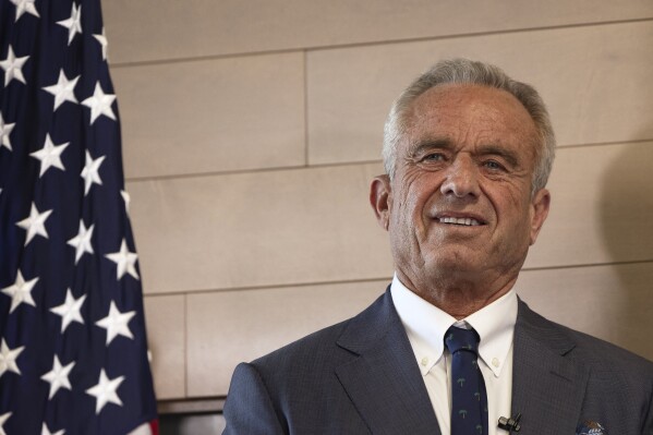 Health and Human Services Secretary Robert F. Kennedy Jr. looks on during a press conference about Utah's new fluoride ban, food additives and SNAP funds legislation, Monday, April 7, 2025, in Salt Lake City. (AP Photo/Melissa Majchrzak)