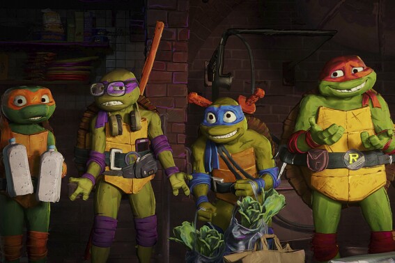 This image released by Paramount Pictures shows, from left, Michelangelo "Mikey", voiced by Shamon Brown Jr., Donatello, "Donnie" voiced by Micah Abbey, Leonardo "Leo", voiced by Nicolas Cantu and Raphael "Raph", voiced by Brady Noon in a scene from "Teenage Mutant Ninja Turtles: Mutant Mayhem." (Paramount Pictures via AP)