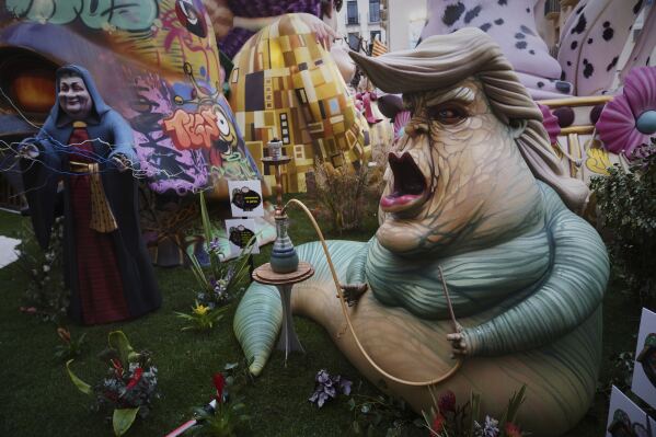 A cardboard sculpture known as "Ninot" depicting U.S. President Donald Trump is displayed during the Fallas festival in Valencia, Spain, on Wednesday, March 19, 2025. (AP Photo/Alberto Saiz)