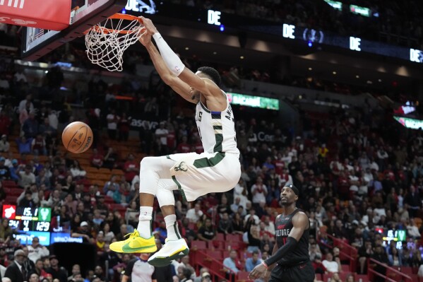 Milwaukee Bucks forward Giannis Antetokounmpo dunks the ball during the second half of an NBA basketball game against the Miami Heat, Tuesday, Nov. 28, 2023, in Miami. (AP Photo/Wilfredo Lee)