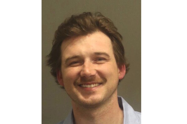 This photo released by the Metro Nashville Police Department shows Country music artist Morgan Wallen. Wallen has been arrested after police say he threw a chair off the rooftop of a newly opened six-story bar in downtown Nashville, Tenn., early Monday, April 8, 2024. (Metro Nashville Police Department via AP)