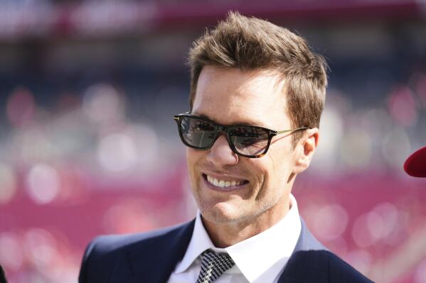 Former NFL quarterback Tom Brady makes an appearance on the field before an NFL football game between the New Orleans Saints and the Tampa Bay Buccaneers, Sunday, Jan 5, 2025, in Tampa, Fla. (AP Photo/Peter Joneleit, File
