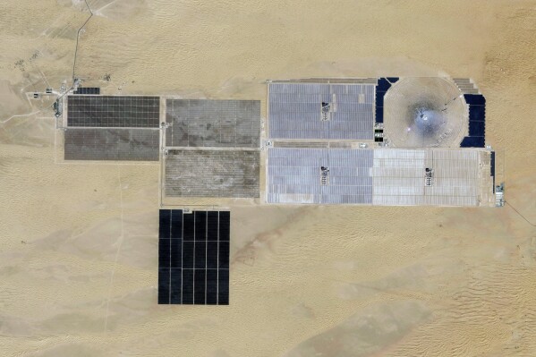 This satellite photo from Planet Labs PBC shows the Mohammed bin Rashid Al Maktoum Solar Park being built on the outskirts of Dubai, United Arab Emirates, Oct. 30, 2023. The solar park represents a pledge of billions of dollars by this city-state to reach its goal of becoming carbon-neutral by 2050. (Planet Labs PBC via AP)