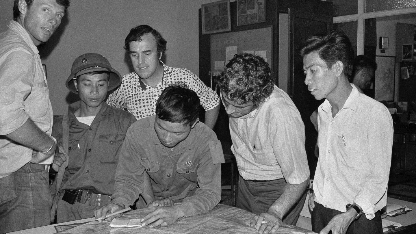 As communist troops streamed into Saigon, a few remaining reporters kept photos and stories flowing