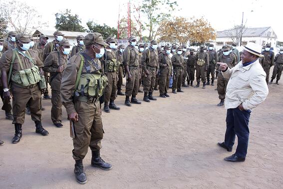 In this photo supplied by the Mozambican Presidency, President Filipe Nyusi, right, during a visit to his Defence and Security Force Troops in Northern Mozambique, Friday, July 9, 2021. Rwandan troops have joined the Mozambican forces to launch a major offensive against Islamic rebels in northern Mozambique as more troops arrive from South Africa and other neighboring countries to help battle the insurgency. (Photo Mozambique Presidency via AP)