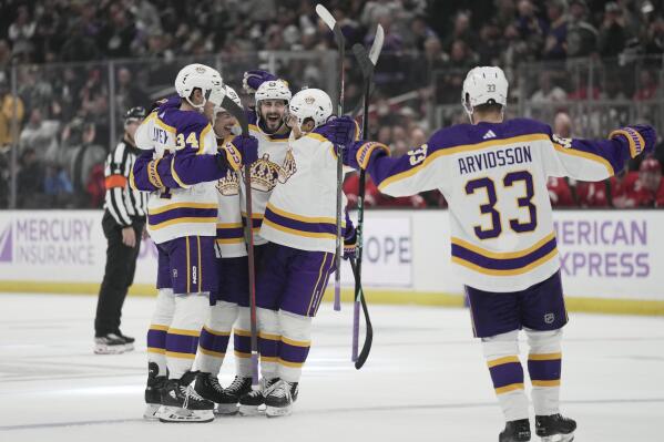 Los Angeles Kings defenseman Sean Durzi celebrates a goal with Los